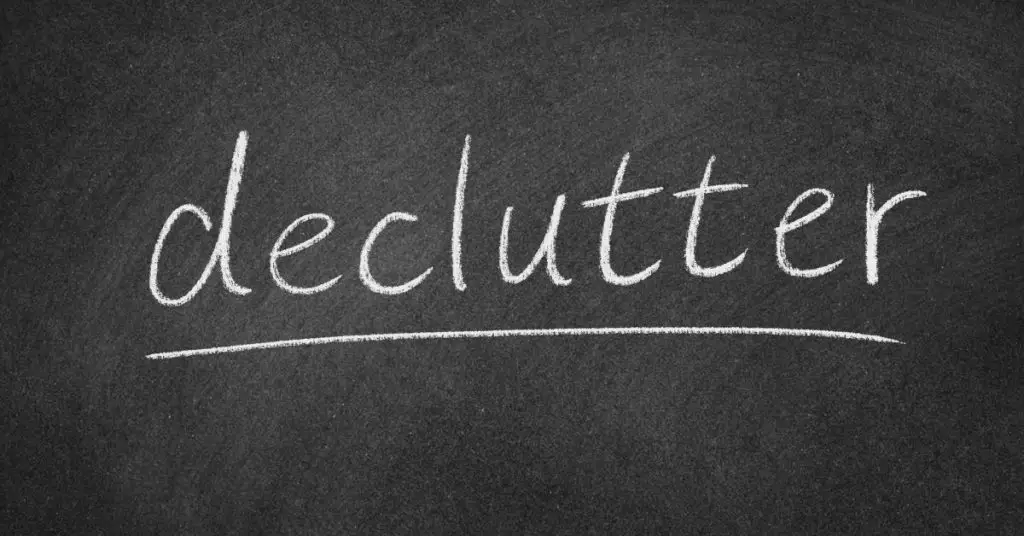 Declutter written on Blackboard - How to Quickly Declutter Your Home - Clean and Tidy Living