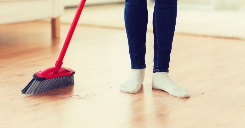 Woman Brushing LVT Floor - Steam Cleaning Karndean Flooring - Clean and Tidy Living