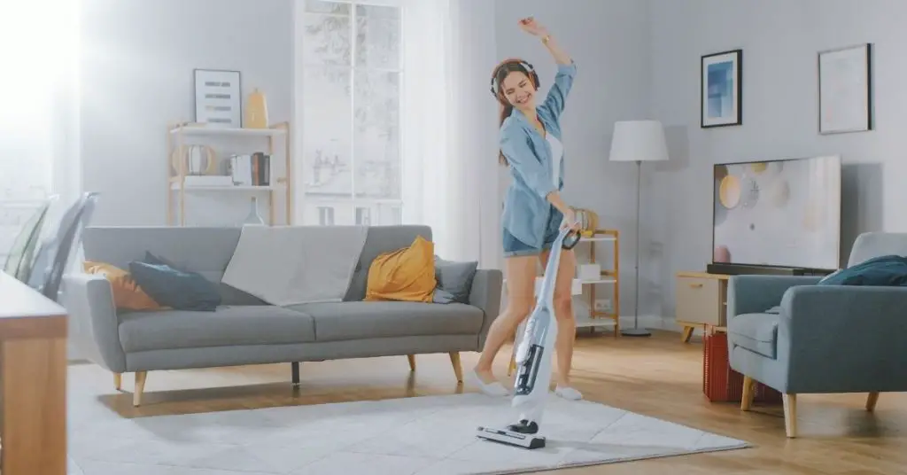 Woman Whizzing Round With a Cordless Hoover Cleaning - Time Saver Tips - Clean and Tidy Living