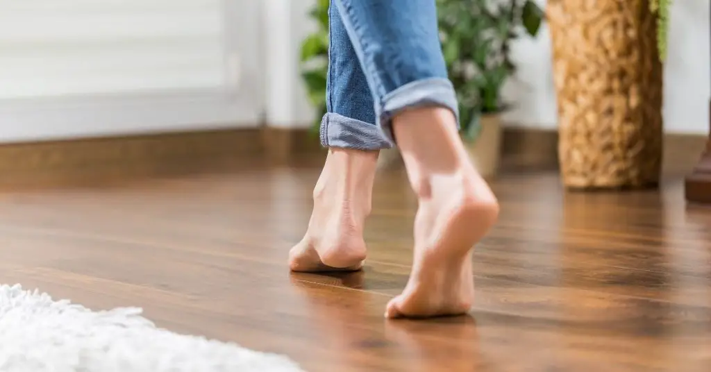 Woman walking on Karndean LVT flooring - Can you steam clean_ - Clean and Tidy Living