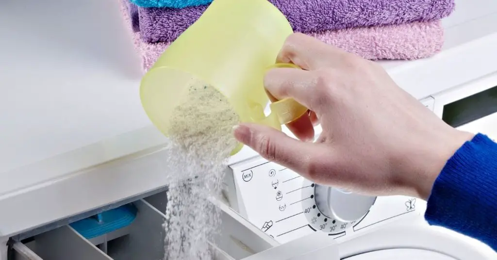 Pouring Laundry Powder in a Washer Dryer - Clean and Tidy Living